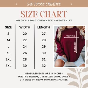 May include: A size chart for a Gildan 18000 crewneck sweatshirt by Sad Prose Creative. The chart lists sizes S through 3XL with corresponding width and length measurements in inches. An inset photo shows a maroon sweatshirt with width and length arrows.