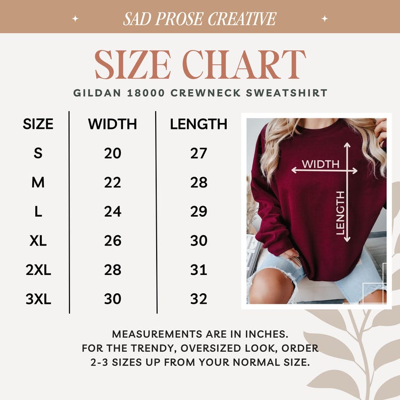 May include: A size chart for a Gildan 18000 crewneck sweatshirt by Sad Prose Creative. The chart lists sizes S through 3XL with corresponding width and length measurements in inches. An inset photo shows a maroon sweatshirt with width and length arrows.