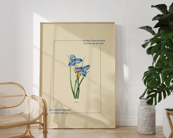 May include: A beige poster with a blue flower illustration and the text "all's well that ends well to end up with you" and "my heart's been borrowed and yours has been blue".