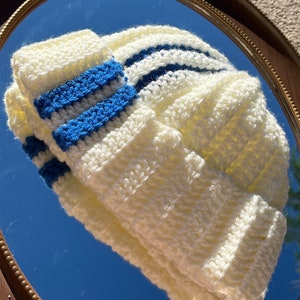 White beanie with blue stripes