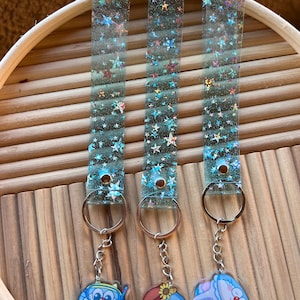 Dora.emon keychains with star sparkly vinyl strap
