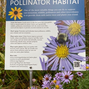 May include: A white sign with the text "Pollinator Habitat" in black letters. The sign has a yellow flower with a black center and a bee with black and yellow stripes. The sign also has a QR code and the text "Leave the leaves: Gently move or rake the leaves into your garden beds as natural mulch for winter. Leaves and logs provide wildlife, pollinators, invertebrates with the winter cover they need and decompose to provide essential nutrients to our soil."
