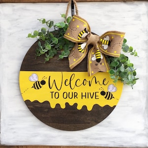 Welcome to our hive, 14" round bumblebee door hanger/wreath/sign, choose your own bow and its position on your hanger, comes ready to hang