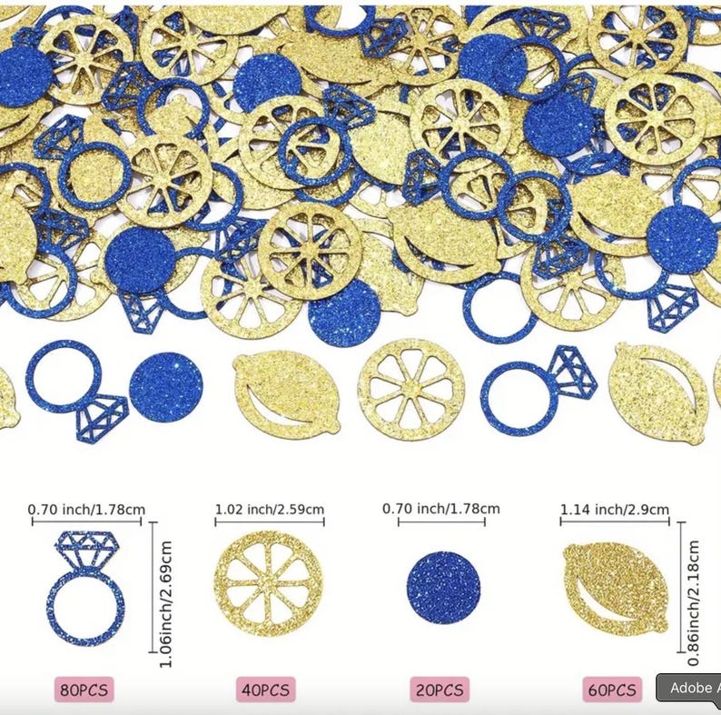 May include: A scattering of gold and blue glitter confetti in assorted shapes, such as circles, lemon slices, diamond rings, and lemon wheel designs. The confetti pieces vary in size, with the largest being 2.9 cm long.