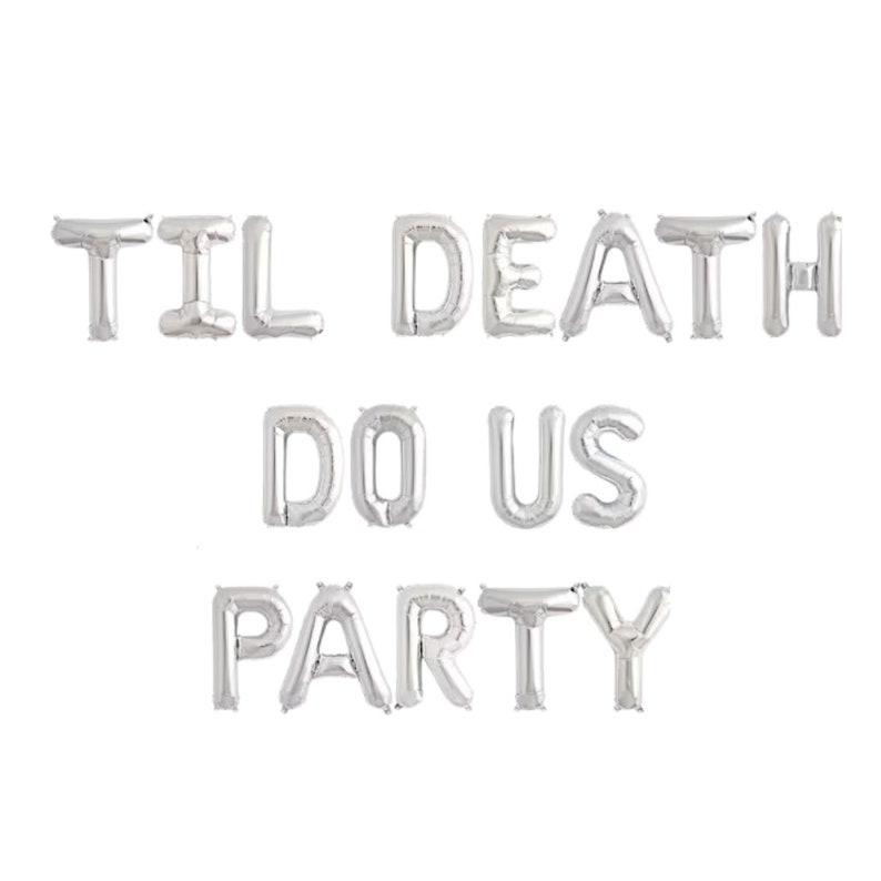 May include: A set of silver foil letter balloons spelling out the phrase TIL DEATH DO US PARTY. The balloons are arranged in three rows, with each letter individually inflated to create a metallic, reflective surface for event decoration.