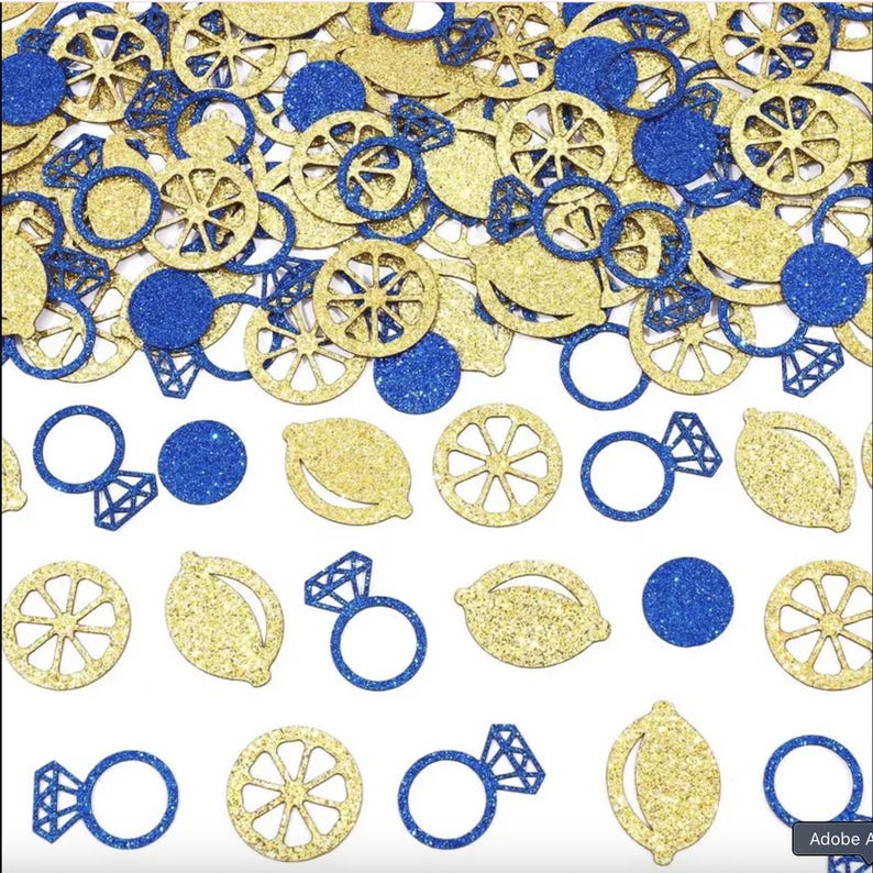 May include: A collection of gold glitter lemon slices, blue glitter circles, and blue glitter diamond ring cutouts on a white background. The confetti is suitable for a wedding or party.