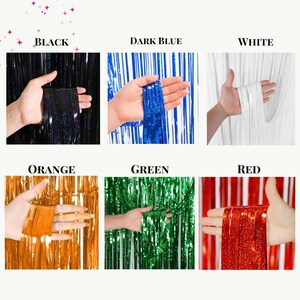May include: Six different colors of metallic fringe curtains. The colors are black, dark blue, white, orange, green, and red.