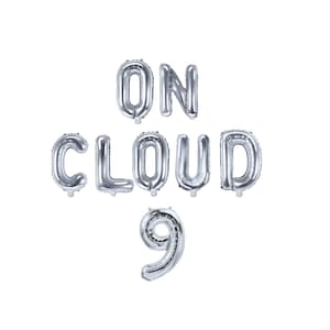 May include: Silver foil balloons spelling out "ON CLOUD 9".