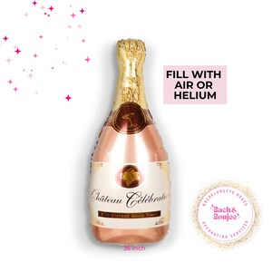 May include: A rose gold champagne bottle shaped foil balloon with the text "Ch&acirc;teau C&eacute;l&eacute;brala For Vintage Good Times" and "36 Inch". The balloon is ready to be filled with air or helium.