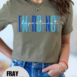 May include: A green t-shirt with the text "EMERGENCY department" in blue and white lettering. The text is stacked vertically with the word "department" written in cursive.