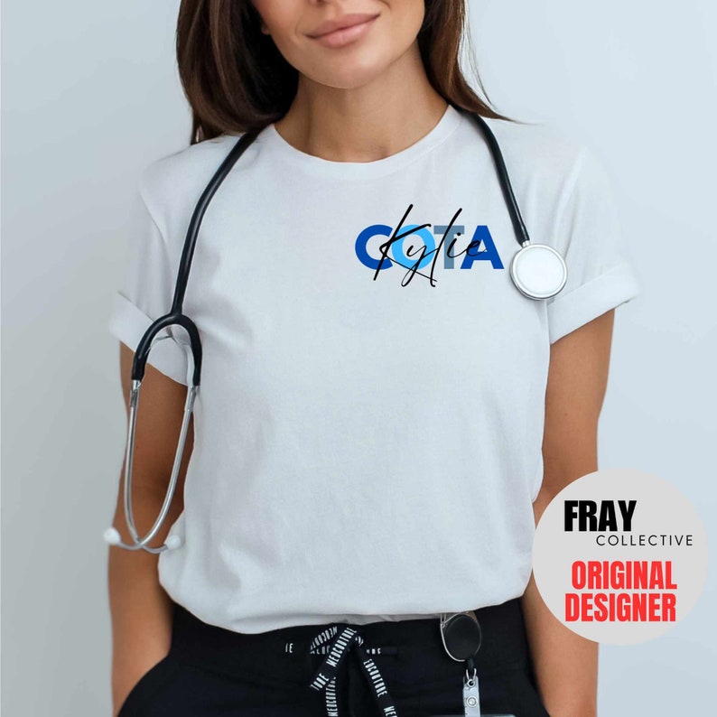 May include: White t-shirt with a blue and black design that says "COTA" with a signature underneath. The shirt is worn by a person with a stethoscope around their neck. The text "FRAY COLLECTIVE ORIGINAL DESIGNER" is in a white circle with a black outline.