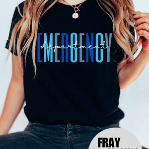 May include: A black t-shirt with the text "EMERGENCY department" in blue and gray lettering. The text is stacked vertically with the word "department" written in cursive script.