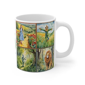 May include: White ceramic mug featuring watercolor illustrations from The Wizard of Oz. The design includes Dorothy on the yellow brick road, the Scarecrow in a field, the Tin Man in a forest, and the Cowardly Lion. The mug has a white handle.