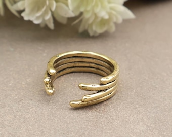 Bold, adjustable brass multi-strand wrap ring that creates a textured, chunky statement look., Christmas gift