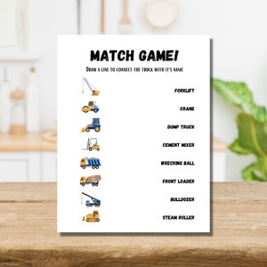 May include: A printable construction vehicle matching game. The game features illustrations of different construction vehicles, including a forklift, crane, dump truck, cement mixer, wrecking ball, front loader, bulldozer, and steam roller. The game instructs players to draw a line to connect each vehicle with its name.
