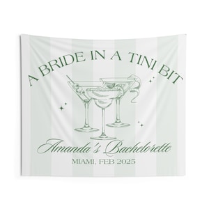 May include: A white and green striped banner with the text "A Bride in a Tini Bit" and a drawing of three martini glasses. The text "Amanda's Bachelorette" and "Miami, Feb 2025" is also included.