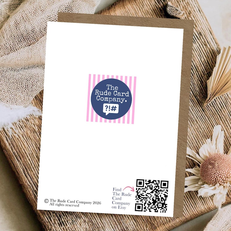 May include: A white greeting card back featuring a central dark blue circular logo with the text The Rude Card Company and symbols ?!#. Below is a black QR code with the text Find The Rude Card Company on Etsy and a copyright notice.