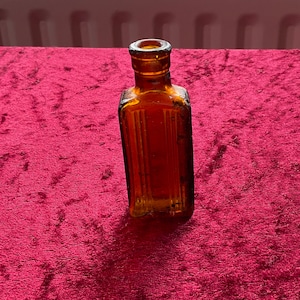 Small 1/2 oz Amber glass poison bottle