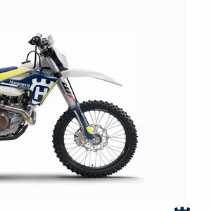 May include: A white and blue Husqvarna motorcycle with a yellow and black front wheel. The motorcycle is a dirt bike with a high-mounted exhaust and a large front fender. The text "REPAIR MANUAL 2017" is at the top of the image. The text "FE 450 FE 501 Art. no. 3403049en" is at the bottom of the image.