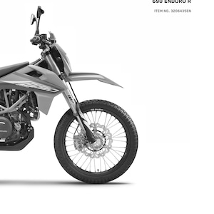 May include: A black and white image of a 2021 KTM 690 Enduro R motorcycle. The motorcycle is shown from the front, with the front wheel and front suspension visible. The text "READY TO RACE" and "690 ENDURO R" is visible in the top right corner of the image. The text "ITEM NO. 3206435EN" is visible below the text "690 ENDURO R".