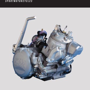 May include: A silver motorcycle engine with a black and orange KTM logo. The engine is labeled "250/300/380 SX,MXC,EXC" and "REPAIR MANUAL ENGINE".
