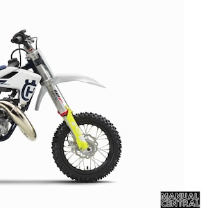 May include: A white and blue Husqvarna TC 50 Mini dirt bike with yellow front forks. The bike is on a white background. The text "REPAIR MANUAL 2020" is at the top of the image. The text "TC 50" and "TC 50 Mini" is at the bottom of the image. The text "Item no. 3403101en" is at the bottom of the image.