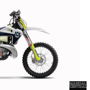 May include: A repair manual for a 2021 Husqvarna motorcycle. The manual covers the TE 250i, TE 300i, and TE 300i Rockstar Edition models. The image shows a close-up of the front wheel of the motorcycle.