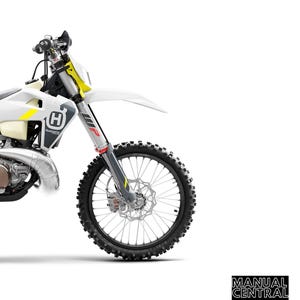 May include: A white and yellow Husqvarna motorcycle with a black and grey front wheel. The motorcycle is a 2022 model and is available in TE 250i, TE 300i, and TE 300i Rockstar Edition.