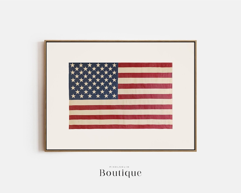 May include: A framed print of a vintage American flag with faded red, white, and blue colors. The flag is slightly worn and has a rustic look.