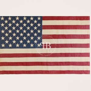May include: A vintage American flag with 48 stars, featuring red and white stripes on a faded white background. The flag is slightly worn and has a distressed look.