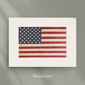 May include: A vintage-style American flag printed on a white background. The flag is faded and has a distressed look.