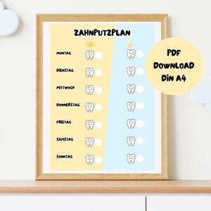 May include: A framed dental hygiene chart with the German text "Zahnputzplan" at the top. The chart is divided into yellow and blue sections, with days of the week listed and tooth illustrations. A yellow circle with "PDF Download Din A4" is on the right.