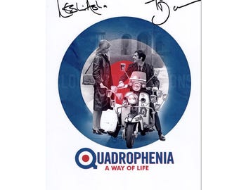 May include: A poster featuring a scene from the movie Quadrophenia. The image shows a couple near a vintage scooter with a Union Jack target design in the background. The title "Quadrophenia: A Way of Life" is displayed at the bottom, with signatures at the top.