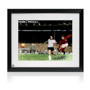 Geoff Hurst Signed England Football Photo: 1966 World Cup. Standard Frame