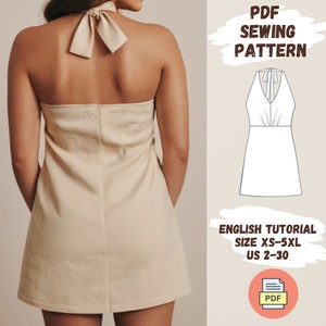 May include: A PDF sewing pattern for a halter dress with a tie at the back. The pattern includes sizes XS-5XL and US sizes 2-30. The pattern is shown on a model wearing a beige dress.
