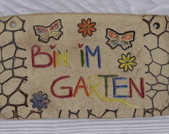 Ceramic sign, saying "I'm in the garden", pottery