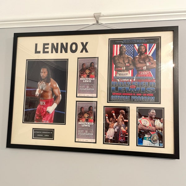 An original signed photograph by Lennox Lewis (with COA) With original programs and tickets framed