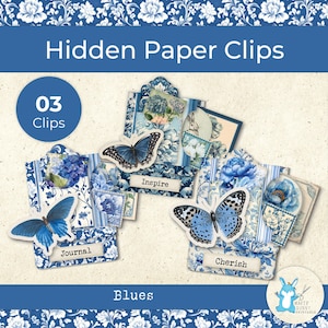 May include: Blue paper clips with butterfly and floral designs. The clips have the words "Inspire", "Journal", and "Cherish". The image also includes the text "Hidden Paper Clips", "03 Clips", and "Blues".