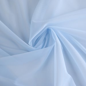 May include: A light blue sheer fabric with a soft, delicate texture. The fabric is draped and folded, creating a smooth, flowing look.