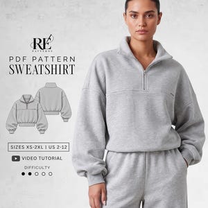 May include: A light gray quarter-zip sweatshirt with long sleeves and a high collar. The text reads RE PATTERNS PDF PATTERN SWEATSHIRT, SIZES XS-2XL | US 2-12, VIDEO TUTORIAL, and DIFFICULTY with two filled circles out of five.
