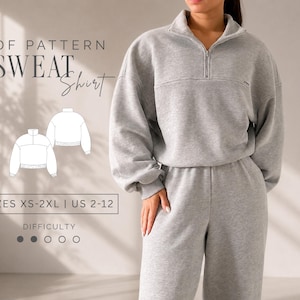 Puede incluir: Una sudadera gris claro con cuello de cremallera, mangas largas y corte holgado. La imagen incluye el texto PDF PATTERN SWEATSHIRT, SIZES XS-2XL | US 2-12, y DIFFICULTY con un círculo relleno de un total de cinco círculos.