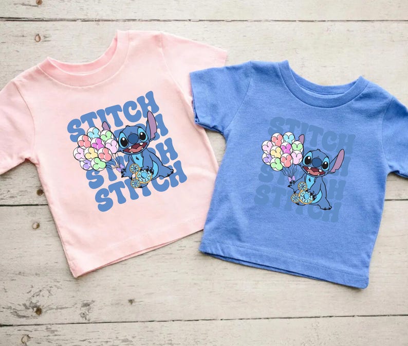 May include: Two t-shirts featuring Stitch from Lilo & Stitch. The pink shirt has a blue Stitch holding balloons with the text "Stitch Stitch Stitch" in a retro font. The blue shirt has a blue Stitch holding balloons with the text "Stitch Stitch Stitch" in a retro font.