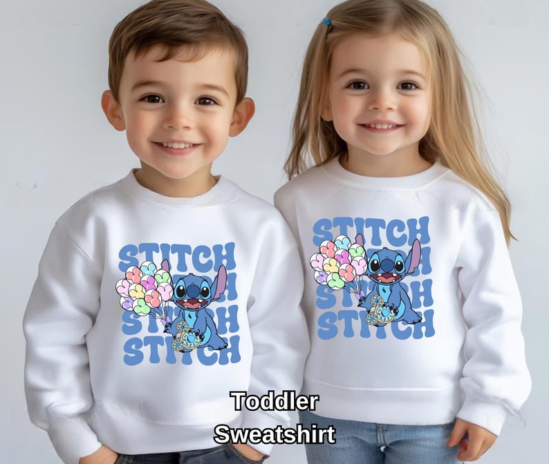 May include: Two white toddler sweatshirts with a blue Stitch character holding balloons. The text "Stitch" is repeated in a retro font on each shirt.