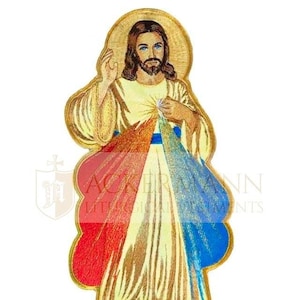 May include: Embroidered patch of Jesus Christ with a golden halo, wearing a white robe with red and blue rays emanating from his heart. The patch is surrounded by a gold border.