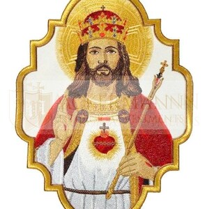 May include: Embroidered patch featuring a depiction of Jesus Christ as King of Kings. He is wearing a crown and a red robe, and holding a scepter. His heart is visible, with a cross and thorns. The patch is surrounded by a gold frame.