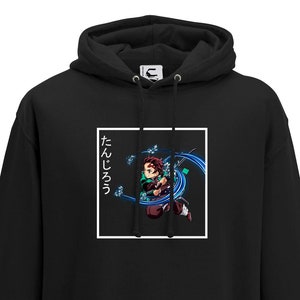 May include: Black hoodie with a white square graphic featuring an anime character with red hair and a blue sword. The text "たんじろう" is written in Japanese on the left side of the graphic.