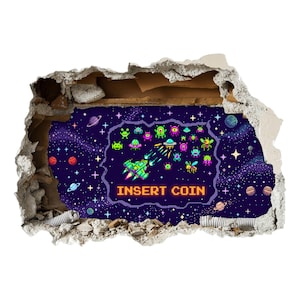 May include: A wall decal featuring a pixel art space scene with a green spaceship firing at various colourful alien enemies against a dark purple starry background. The text INSERT COIN is displayed in orange pixelated letters at the bottom centre.