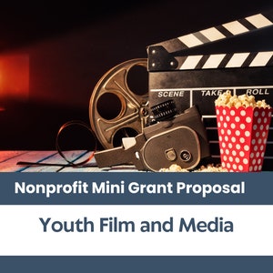 May include: A clapperboard with the words "SCENE", "TAKE", and "ROLL" on it, a vintage film camera, a reel of film, and a red and white polka dot bucket filled with popcorn. The image is set against a dark background with a spotlight shining on the left side of the image. The text "Nonprofit Mini Grant Proposal" and "Youth Film and Media" is displayed below the image.