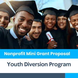 May include: A group of smiling graduates in black caps and gowns pose for a selfie. They are holding diplomas and celebrating their achievement.