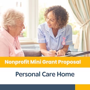 May include: A woman in a blue uniform is sitting at a table with an older woman. The woman in the uniform is writing on a piece of paper. The text on the image reads "Nonprofit Mini Grant Proposal Personal Care Home".
